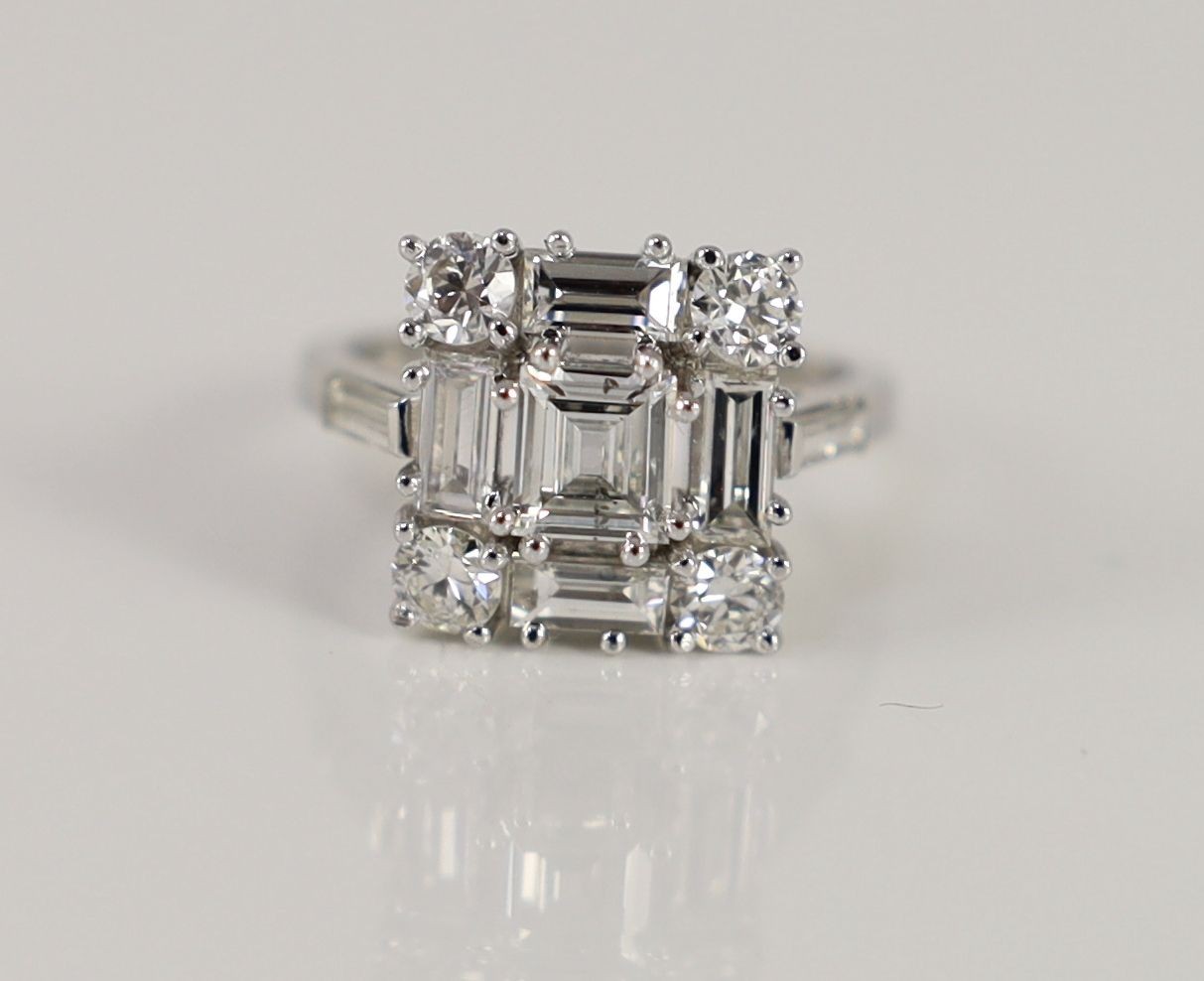 A square, baguette and round cut diamond set square cluster ring